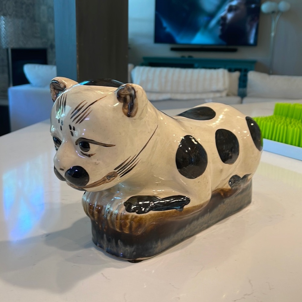 1900s, ceramic cat used for decor. But this was actually used for a headrest!